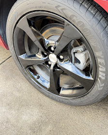 Charger rim in custom gloss black finish — clean, aggressive look