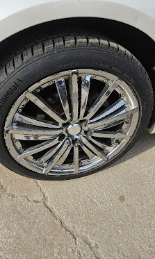 Rim before repair — chrome finish peeling and flaking, clear coat failure